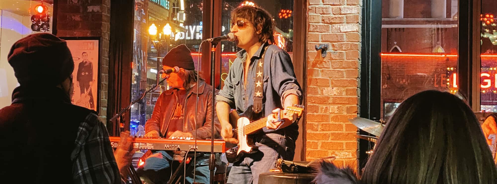 bar singer on guitar in Tuscaloosa