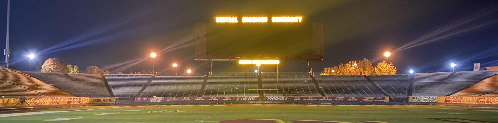 empty football stadium at night under the lights Tuscaloosa